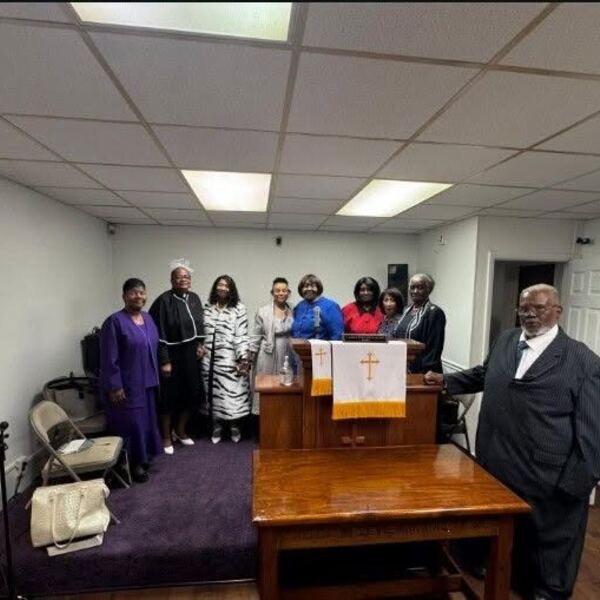Church family gathered at the altar