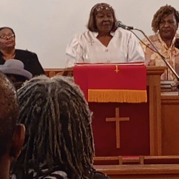 Minister preaching from the pulpit